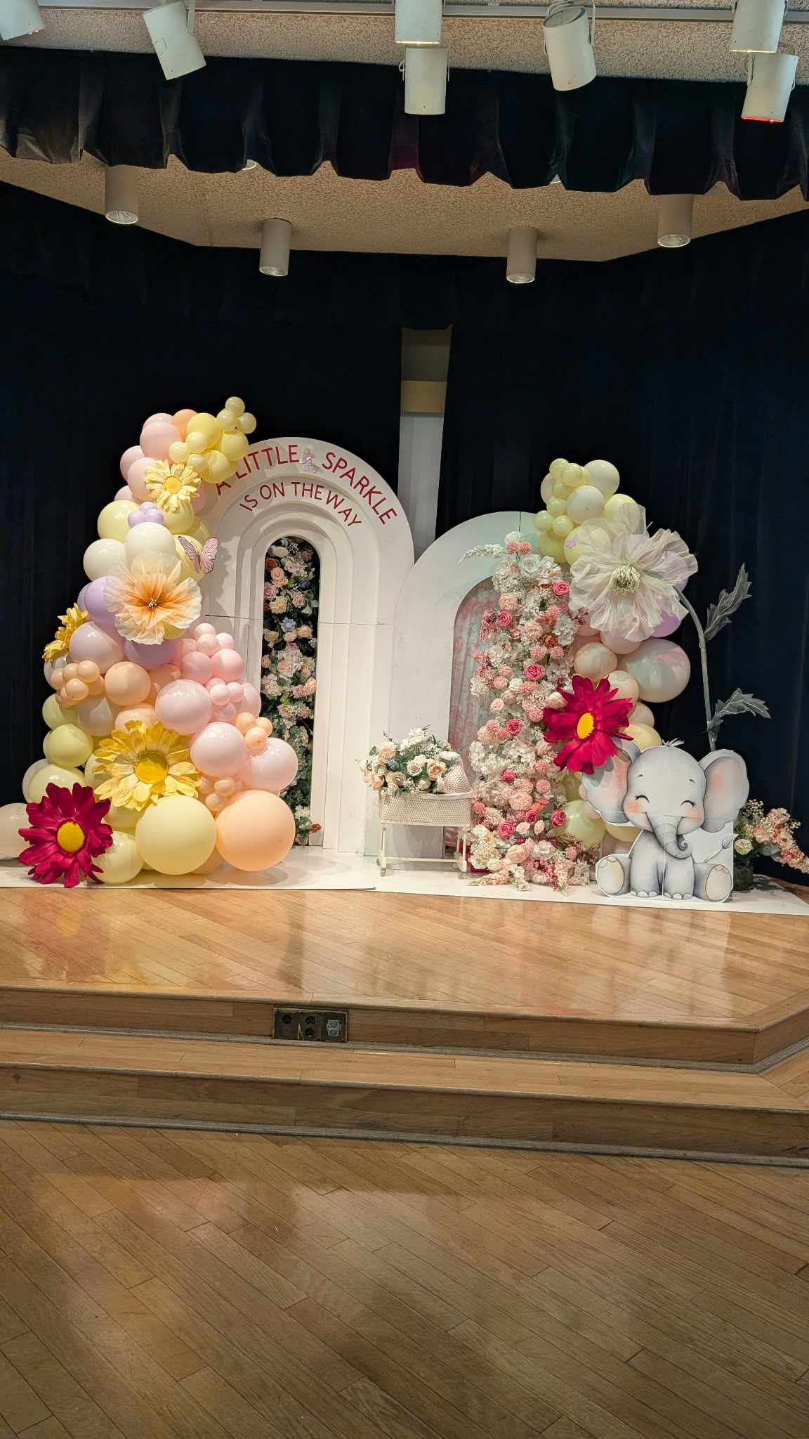 A little sparkle is on the way baby shower balloon arch with florals