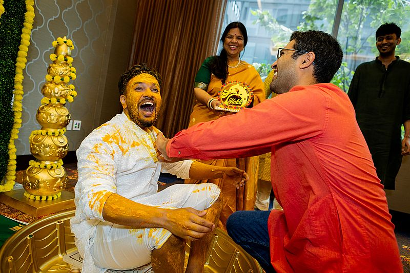 haldi ceremony Indian photography of male in yellow turmeric