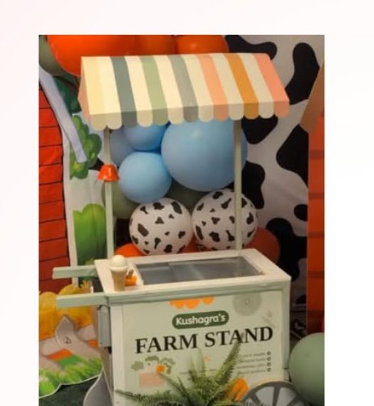 Farm stand candy cart with balloon garland