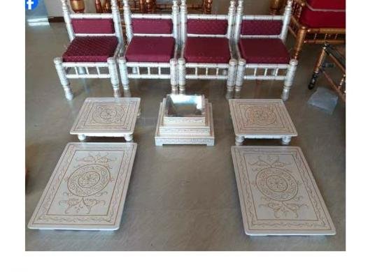 White and gold mandap chairs with matching floor seating pieces