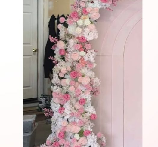 Pink and white cascading floral arch column