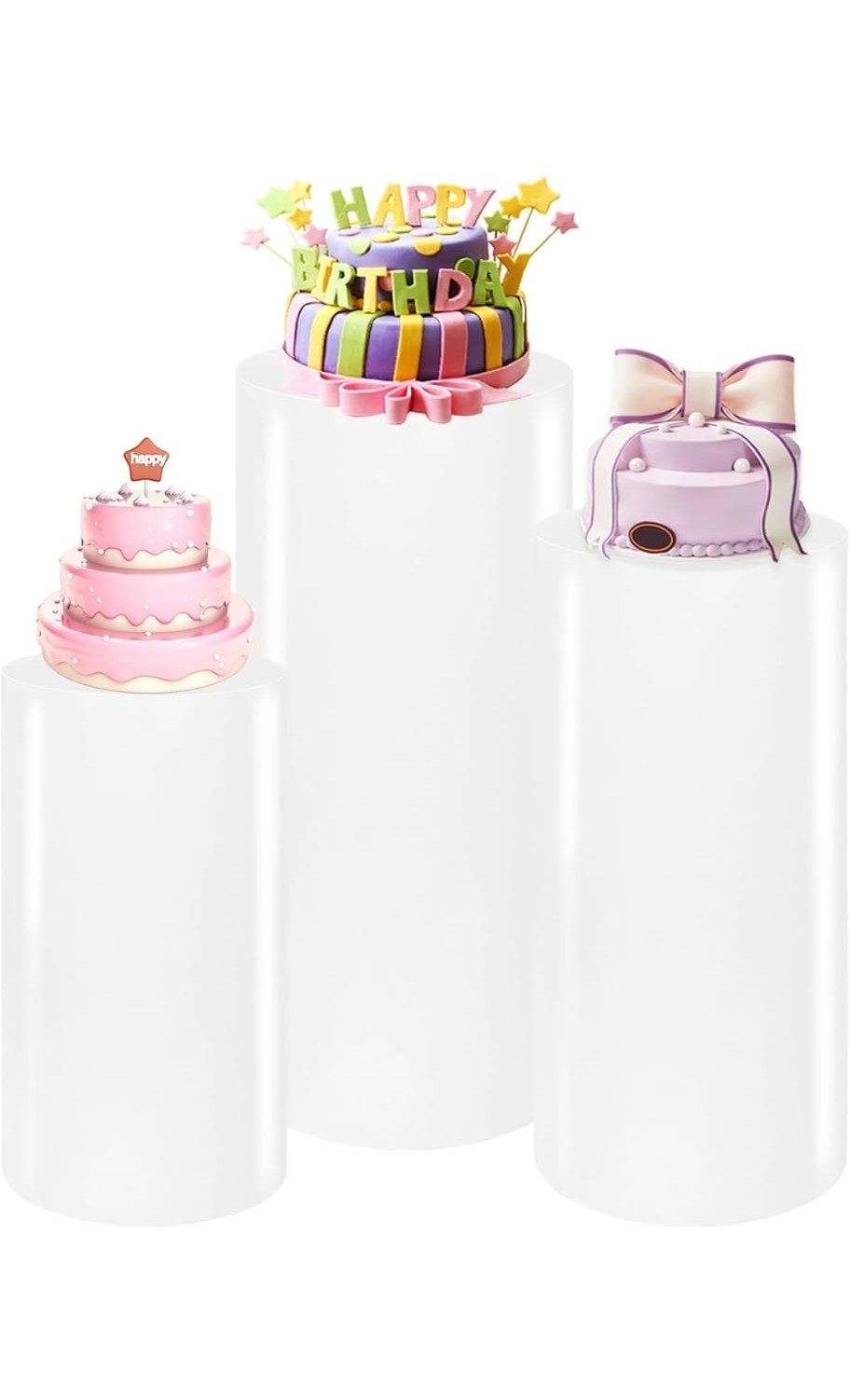 Set of three white cylinder pedestals in varying heights